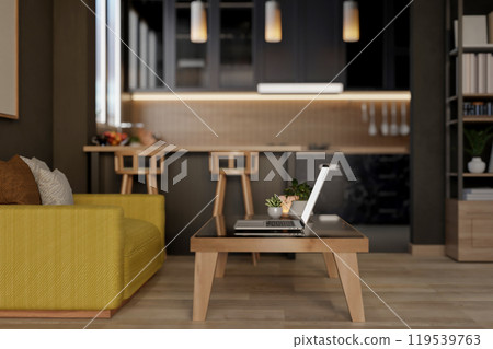A laptop on a coffee table in a living room, featuring an open kitchen space in the background. 119539763