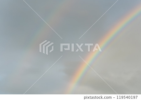 A double rainbow shining in the sky after the rain on an autumn evening | Beautiful double rainbow A double rainbow shining in the sky after the rain on an autumn evening | Beautiful double rainbow 119540197