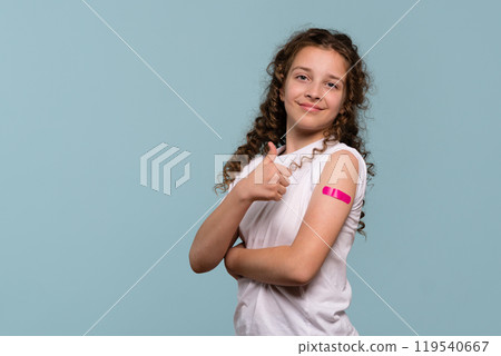 Girl giving thumbs up after vaccination. Girl giving thumbs up after vaccination. 119540667