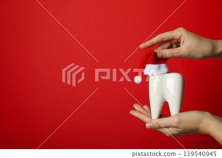 Teeth with Christmas accessories around, flat lay. Teeth with Christmas accessories around, flat lay. 119540945