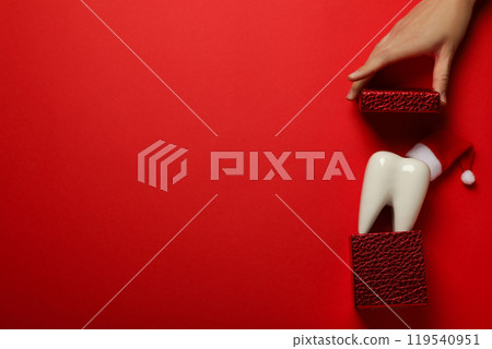 Teeth with Christmas accessories around, flat lay. Teeth with Christmas accessories around, flat lay. 119540951