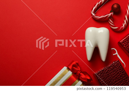 Teeth with Christmas accessories around, flat lay. Teeth with Christmas accessories around, flat lay. 119540953