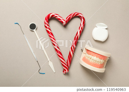 Teeth with Christmas accessories around, flat lay. 119540963