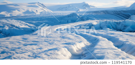 Vast icy landscape under a bright blue sky. 119541170