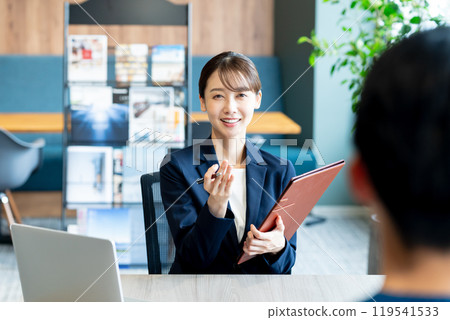 Female consultant at reception 119541533