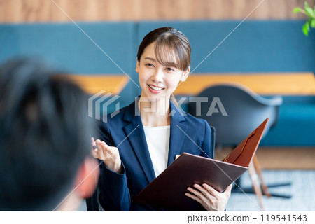 Female consultant at reception Female consultant at reception 119541543
