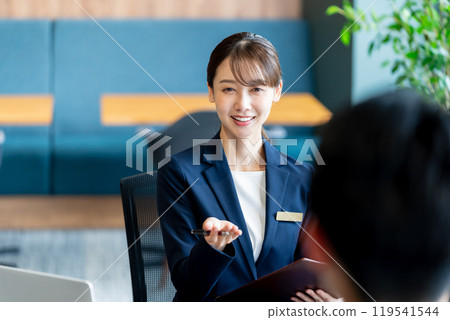 Female consultant at reception Female consultant at reception 119541544
