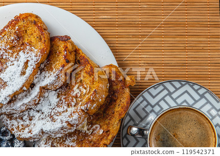 french toast on white plate for breakfast 119542371