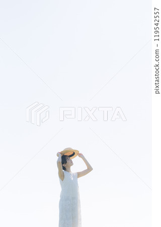 Young woman standing on a hill 119542557