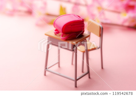 A spring scene with a miniature study desk and school bag decorated with cherry blossoms 119542678