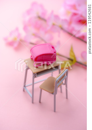 A spring scene with a miniature study desk and school bag decorated with cherry blossoms A spring scene with a miniature study desk and school bag decorated with cherry blossoms 119542681