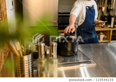 Portrait of a man wearing an apron Portrait of a man wearing an apron 119544219