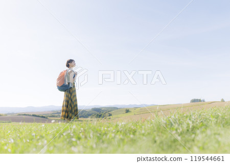 Young woman relaxing in the grass 119544661