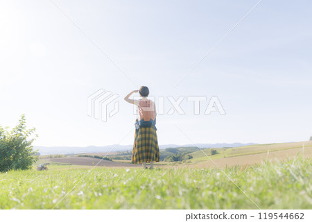 Young woman relaxing in the grass 119544662