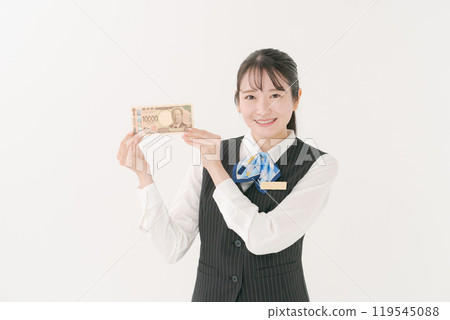 Female employee in uniform holding money Female employee in uniform holding money 119545088