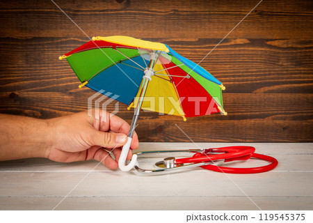 Open Enrollment and health care concept. Doctor's stethoscope on a white wooden table 119545375