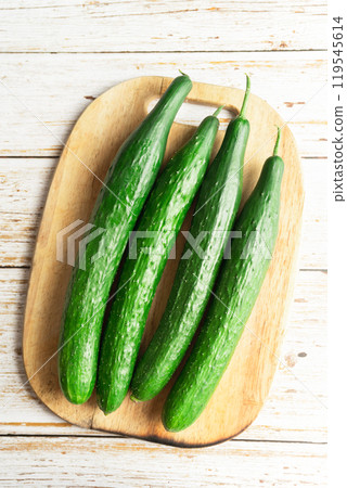 fresh cucumbers on a wooden board 119545614