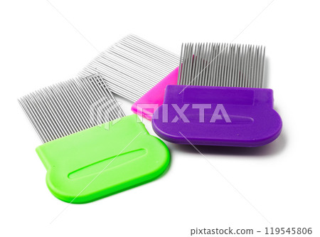 Colorful plastic and metal combs on a white background 119545806