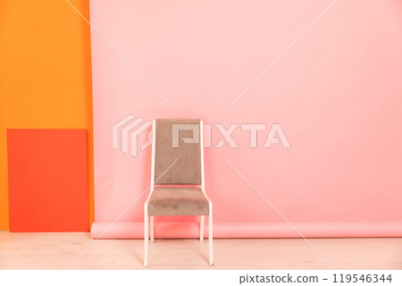 one old vintage chair in the interior of an empty room 119546344