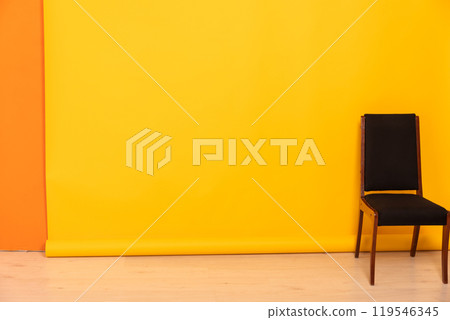 One Old Vintage Chair In Yellow Room Interior One Old Vintage Chair In Yellow Room Interior 119546345
