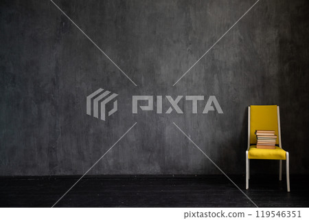 One old vintage chair in the interior of an empty gray room One old vintage chair in the interior of an empty gray room 119546351