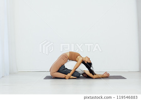 A man and a woman are engaged in steam yoga asana gymnastics fitness 119546883