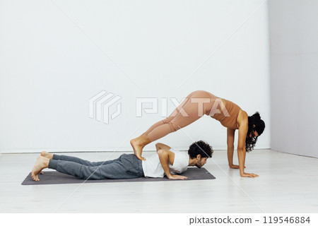 Man And Woman Doing Steam Yoga Asana Gymnastics Man And Woman Doing Steam Yoga Asana Gymnastics 119546884