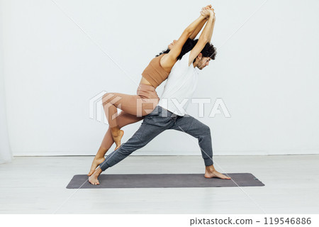 Man and woman doing yoga exercises meditation asana pose 119546886