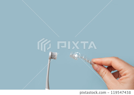 Transparent Dental Clear Aligners on Blue. Invisible Braces. Prevention Gums Treatment. Retainers for Dentistry Correction. Invisalign Orthodontics concept. Alignment of Teeth. Dentofacial Orthopedics 119547438