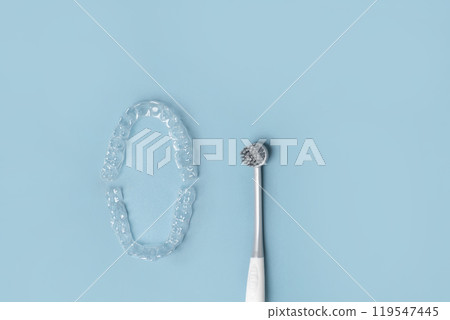 Transparent Dental Clear Aligners on Blue. Invisible Braces. Prevention Gums Treatment. Retainers for Dentistry Correction. Invisalign Orthodontics concept. Alignment of Teeth. Dentofacial Orthopedics Transparent Dental Clear Aligners on Blue. Invisible Braces. Prevention Gums Treatment. Retainers for Dentistry Correction. Invisalign Orthodontics concept. Alignment of Teeth. Dentofacial Orthopedics 119547445