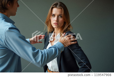 Office harassment depiction, male supervisor touching young female worker shoulder, causing discomfort. Professional woman in business suit shows unease, inappropriate contact, power imbalance 119547908