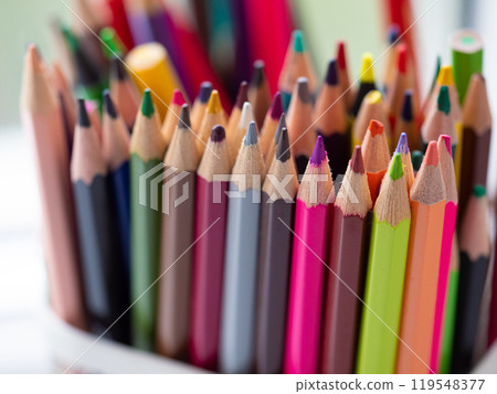 Close-Up of Vibrant Collection of Colorful Colored Pencils in a pen holder. Creative Art. Colourful assortment of sharpened colored pencils for art projects, drawing, and creativity. Artist's studio Close-Up of Vibrant Collection of Colorful Colored Pencils in a pen holder. Creative Art. Colourful assortment of sharpened colored pencils for art projects, drawing, and creativity. Artist's studio 119548377