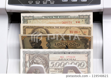 Old Greek drachma in the counting machine Old Greek drachma in the counting machine 119548621
