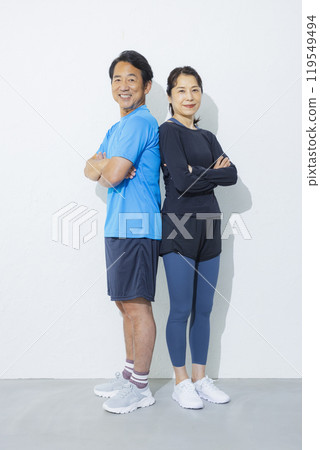 Middle-aged couple in sportswear Middle-aged couple in sportswear 119549494