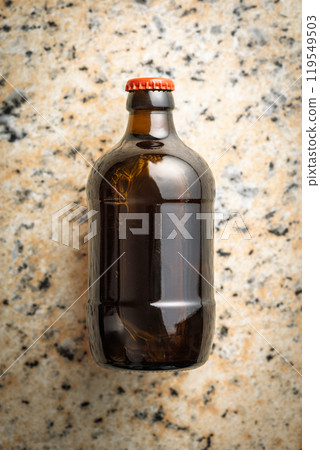 One beer bottle on marble table. Top view. 119549503