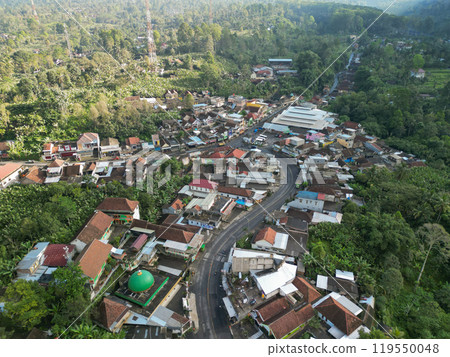 A stunning waterfall and majestic mountain seen from an aerial view 119550048