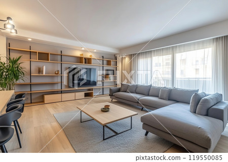 Modern living room interior featuring comfortable furniture, large windows, and a sleek 119550085