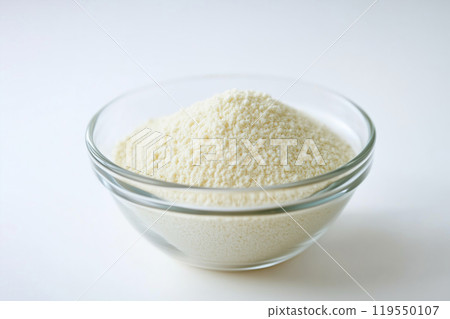 Fine flour piled in a glass bowl ready for baking, captured in a bright kitchen setting during Fine flour piled in a glass bowl ready for baking, captured in a bright kitchen setting during 119550107