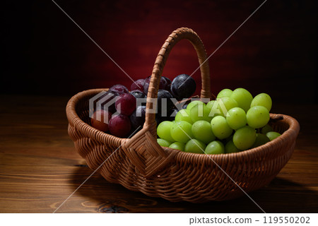 Shine Muscat and Pione grapes in a basket Shine Muscat and Pione grapes in a basket 119550202