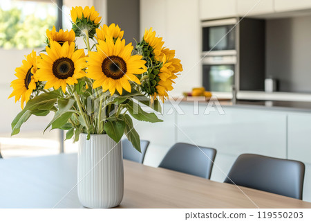 A vibrant bouquet of sunflowers brightens a modern kitchen table in a sunlit open space, creating an A vibrant bouquet of sunflowers brightens a modern kitchen table in a sunlit open space, creating an 119550203