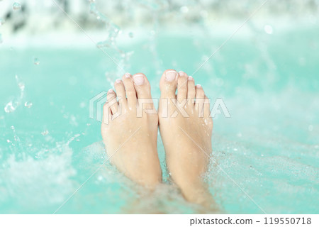 Woman feet in a spa pool Woman feet in a spa pool 119550718