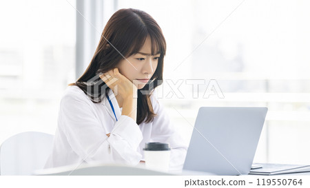Woman/businesswoman thinking using a computer Woman/businesswoman thinking using a computer 119550764