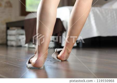 Woman legs stumbling in the bedroom 119550968