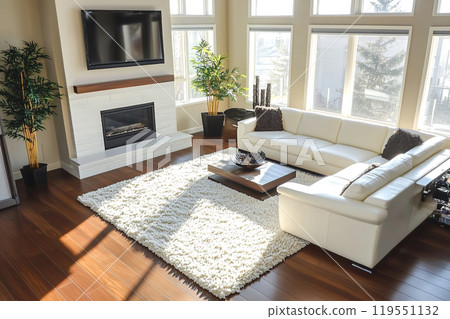 Spacious modern living room with large windows, elegant furniture, and natural light during the day Spacious modern living room with large windows, elegant furniture, and natural light during the day 119551132