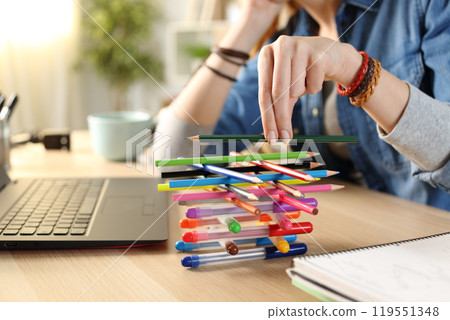 Bored lazy student girl wasting time at home 119551348