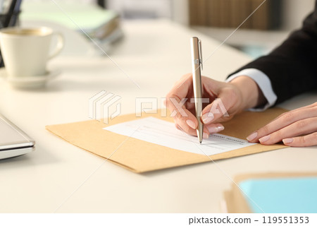 Business woman hand filling out bank check at the office Business woman hand filling out bank check at the office 119551353