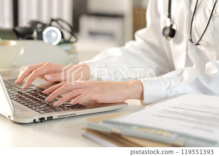Doctor woman hands typing on laptop at the office 119551393