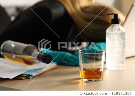 Drunk entrepreneur sleeping on desk on covid-19 confinement Drunk entrepreneur sleeping on desk on covid-19 confinement 119551395