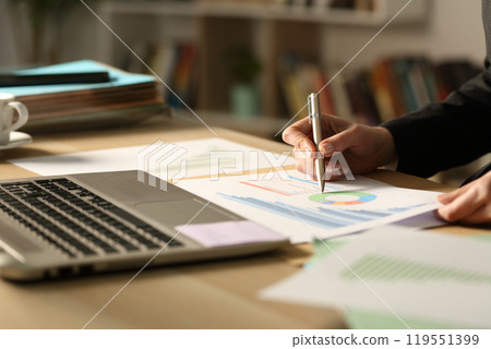 Entrepreneur hand working in the night at home 119551399