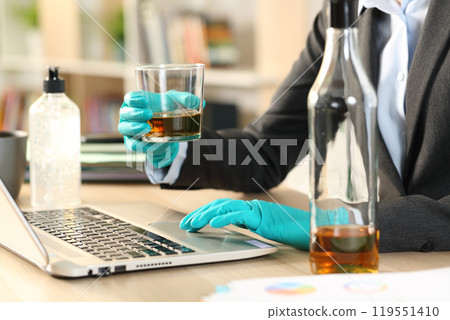 Entrepreneur hands drinking alcohol on coronavirus confinement 119551410